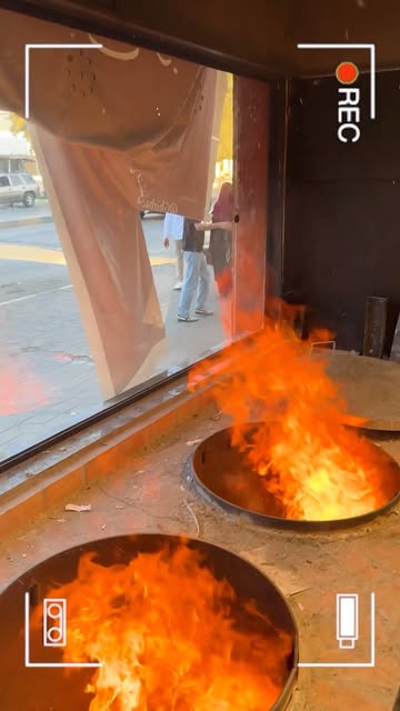 Flames rising from a pan in a kitchen video shared by Ghirbaal